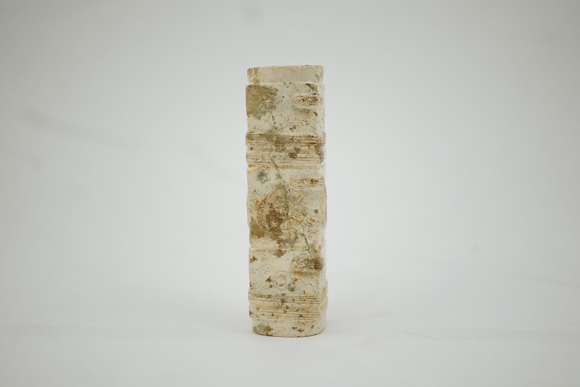Four Chinese archaistic hardstone or burnt jade cong or cylinders